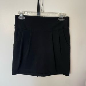 Black mini skirts with zip closure and side pockets
